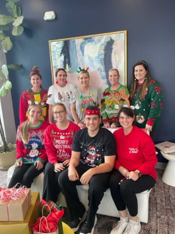 We Have Fun! Staff wearing Christmas Sweaters