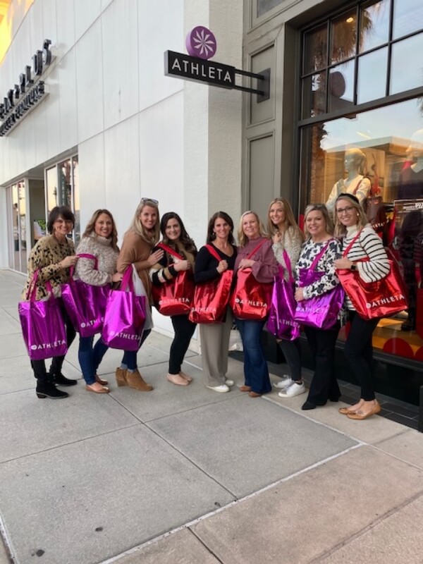 We Have Fun! Staff standing outside of Athleta